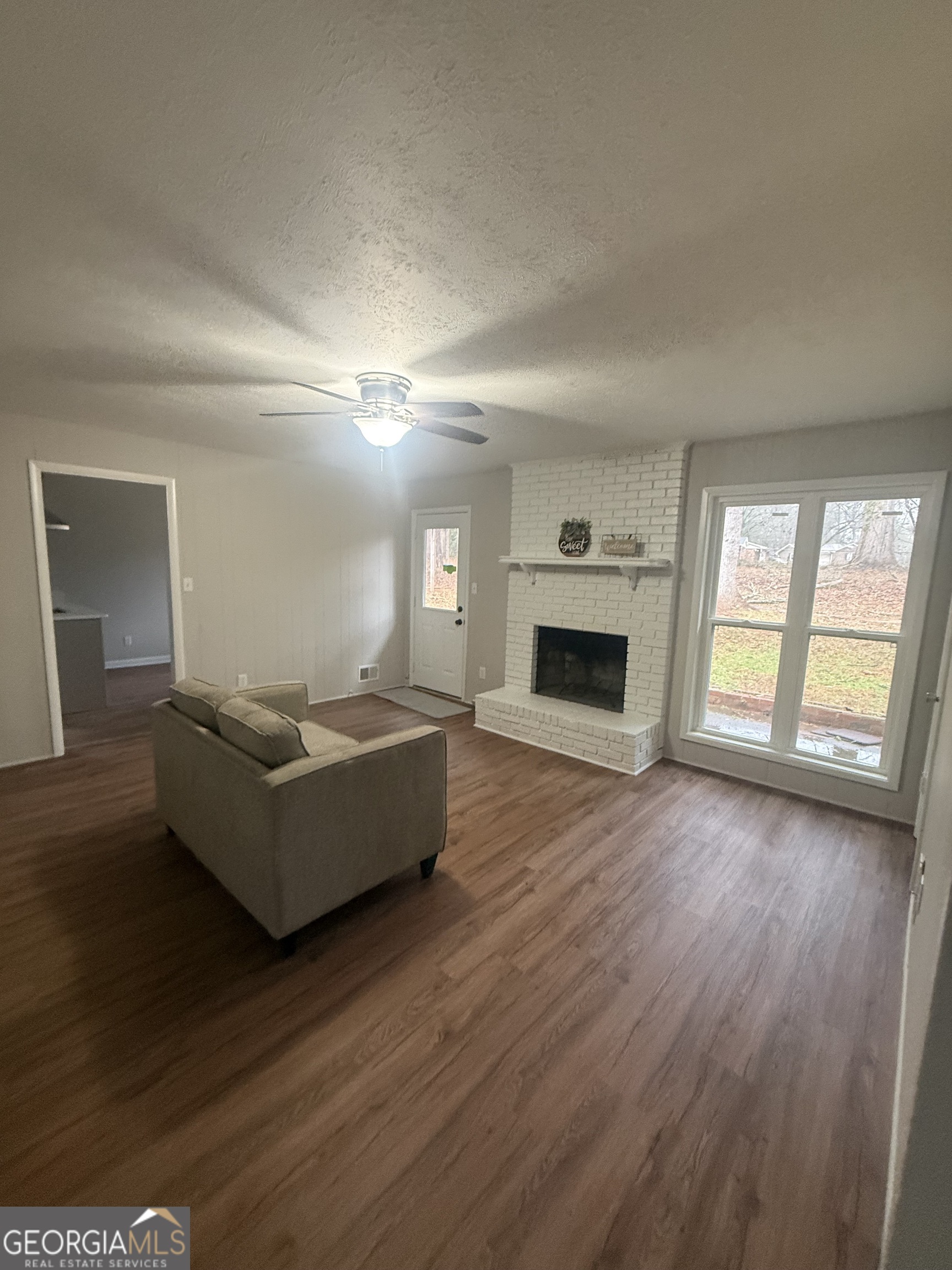 152 Club Circle Stockbridge, GA 30281 - Photo 12 of 17 a living room with furniture and a fireplace