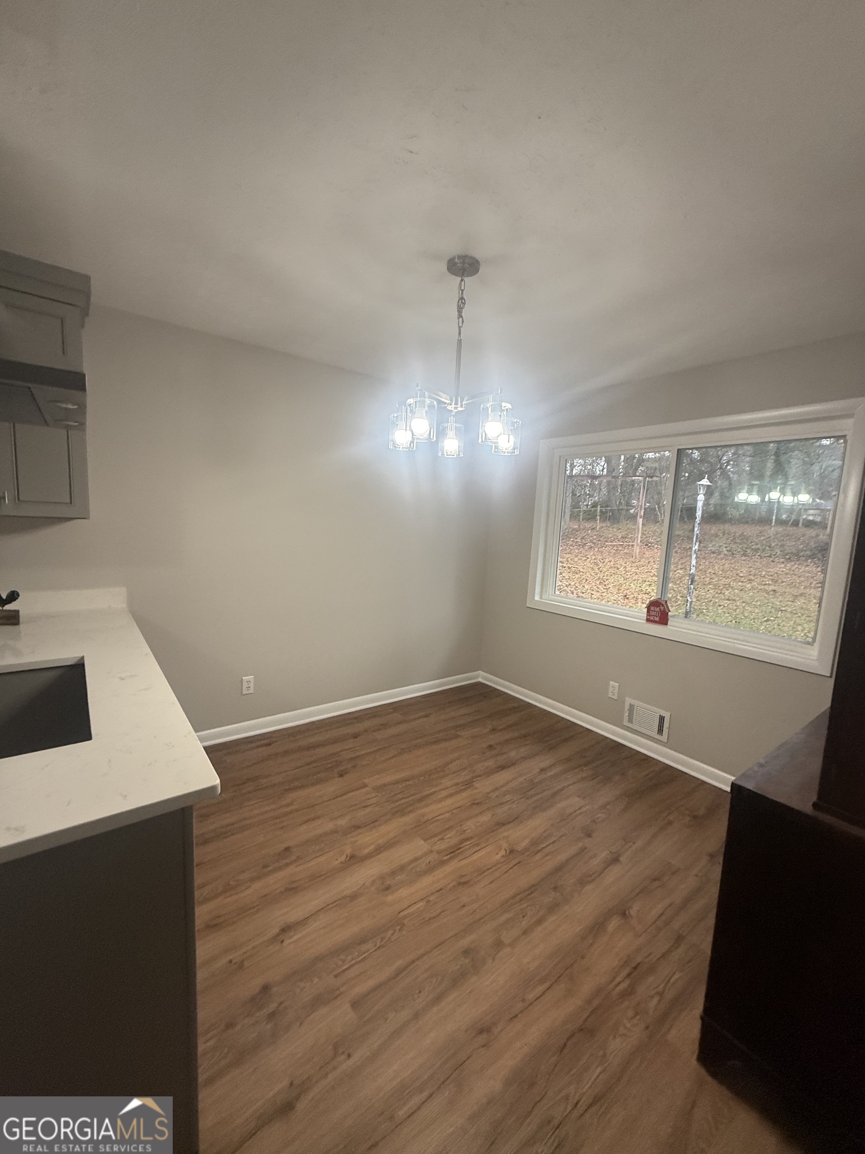 152 Club Circle Stockbridge, GA 30281 - Photo 13 of 17 a view of empty room with wooden floor and fan
