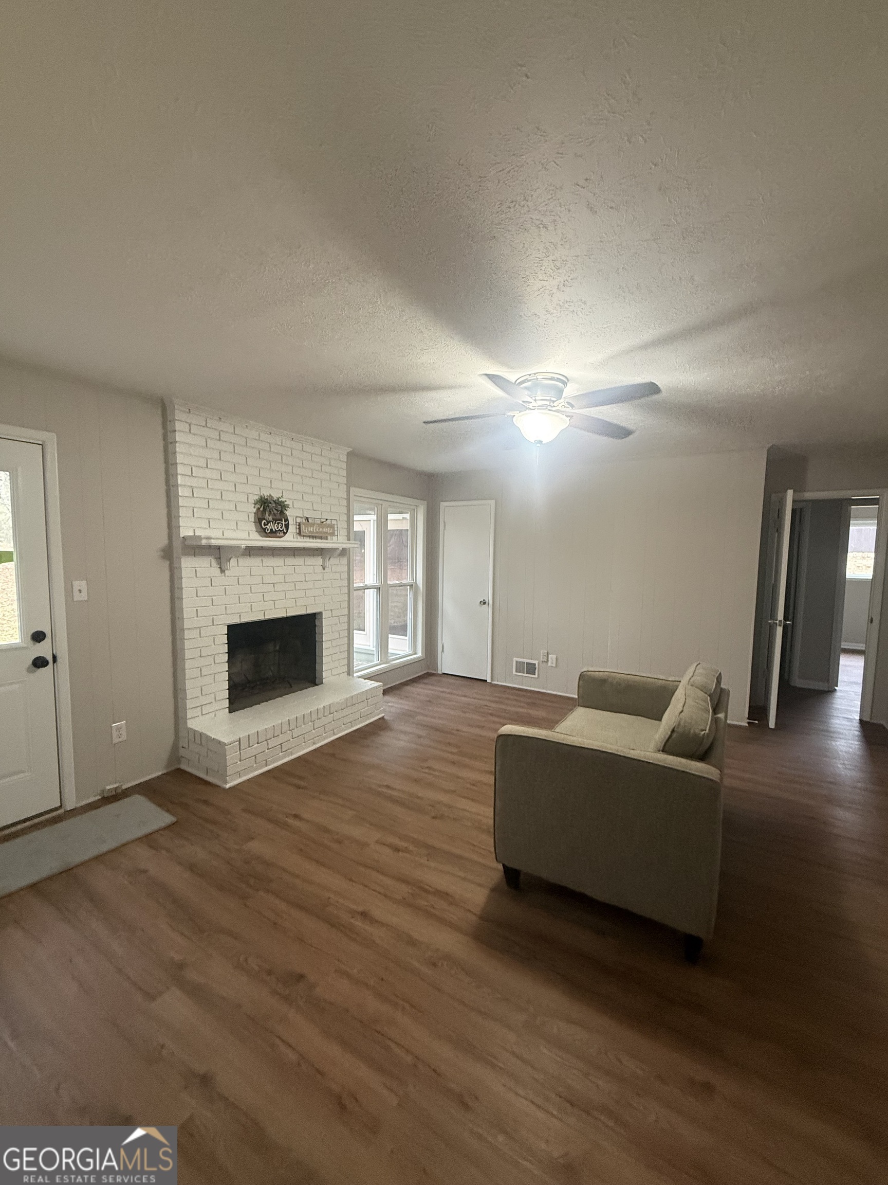 152 Club Circle Stockbridge, GA 30281 - Photo 15 of 17 a living room with furniture and a fireplace