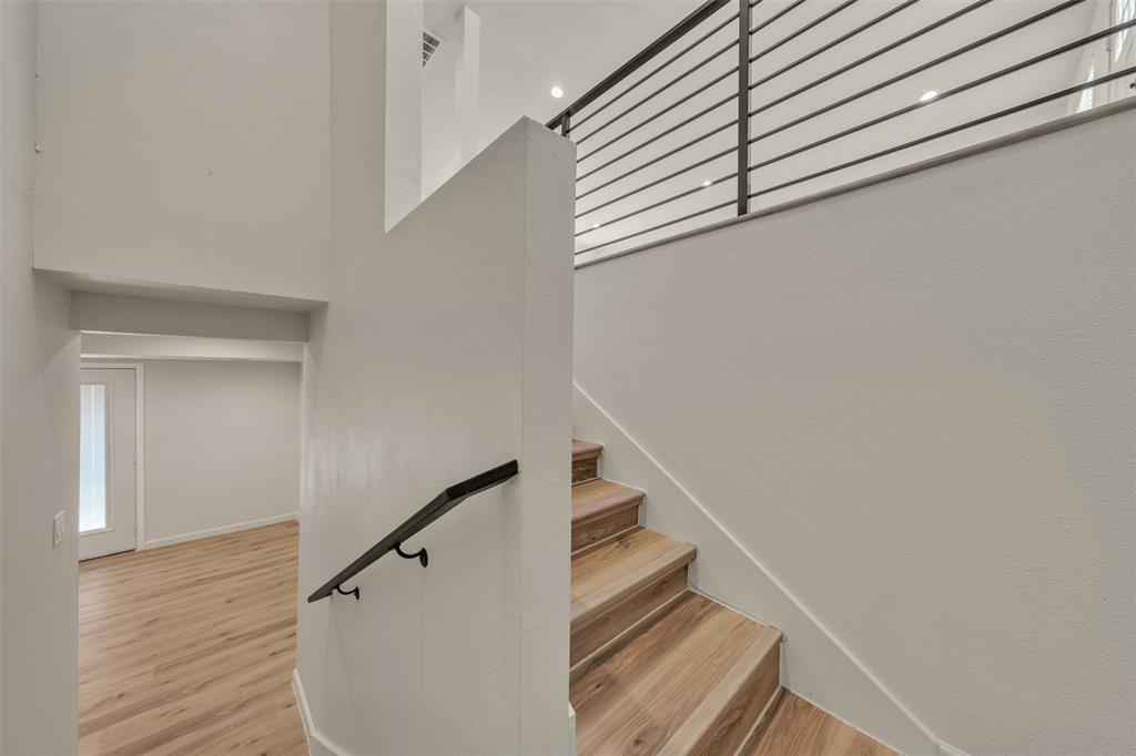 1719 Boot Hill Road Granbury, TX 76049 - Photo 17 of 35 Stairs leading down to lower level of home.