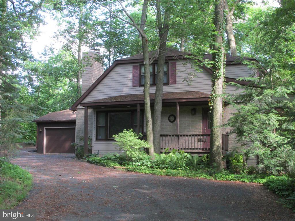 1161 Cider Press Road Manheim, PA 17545 - Photo 1 of 56 a front view of a house with a garden and plants