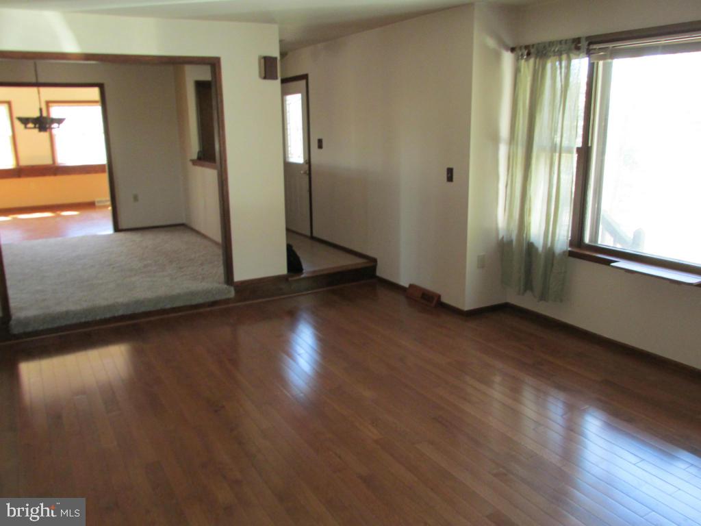 1161 Cider Press Road Manheim, PA 17545 - Photo 2 of 56 an empty room with wooden floor and windows