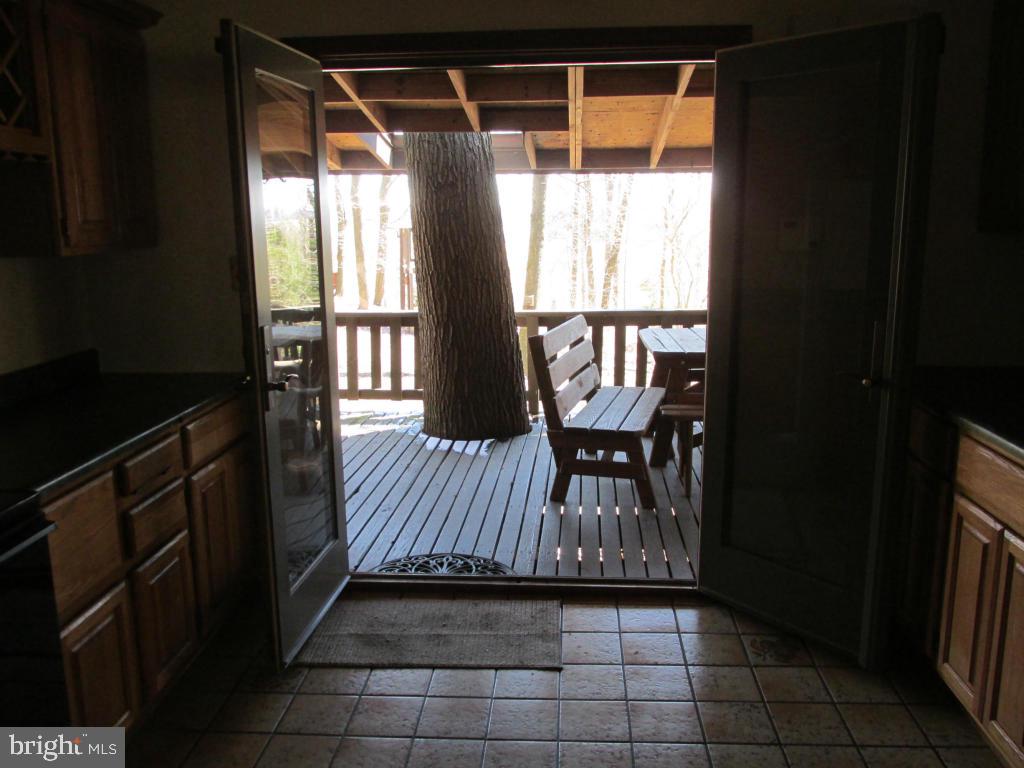 1161 Cider Press Road Manheim, PA 17545 - Photo 11 of 56 a view of deck with furniture and a floor to ceiling window