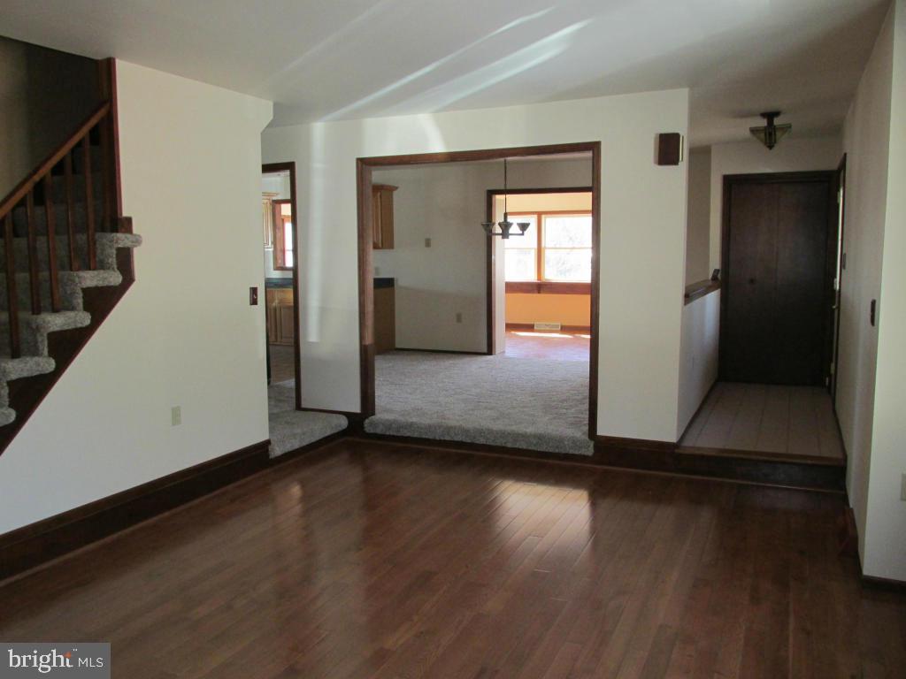1161 Cider Press Road Manheim, PA 17545 - Photo 3 of 56 an empty room with wooden floor and windows
