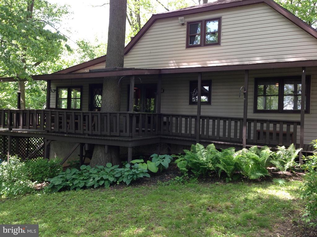 1161 Cider Press Road Manheim, PA 17545 - Photo 52 of 56 a front view of a house with garden and plants