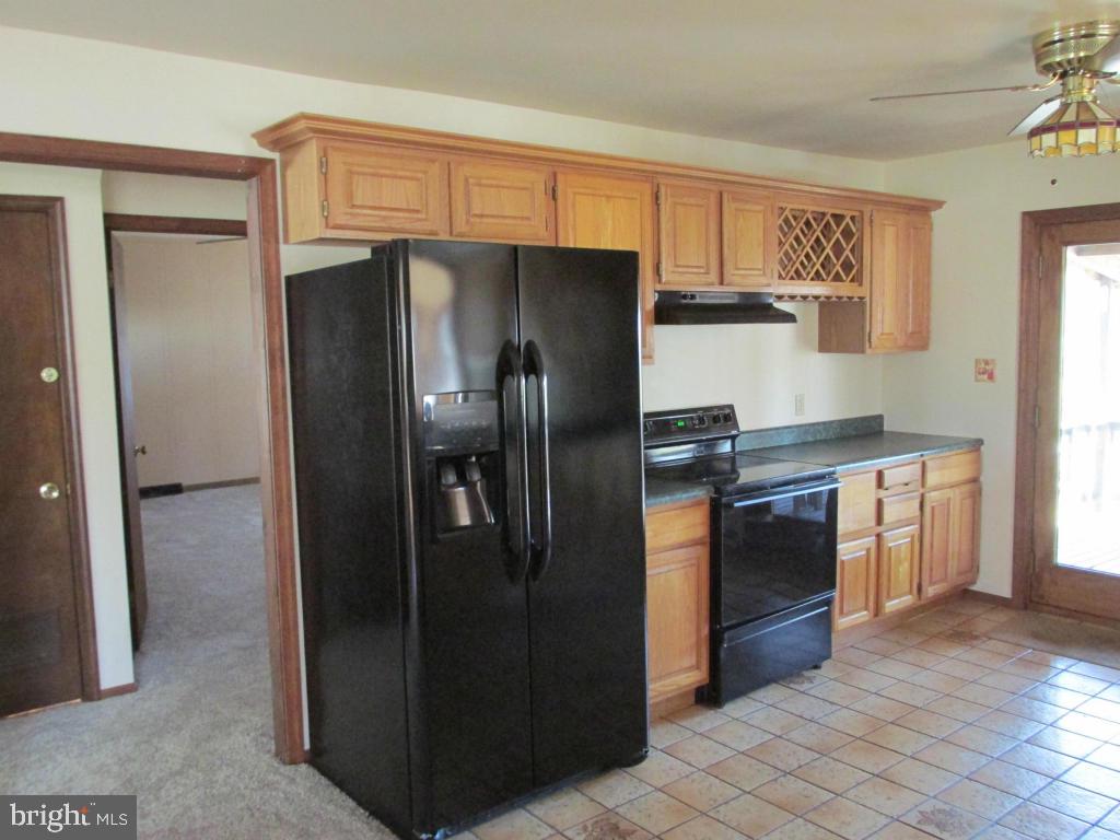 1161 Cider Press Road Manheim, PA 17545 - Photo 9 of 56 a kitchen with stainless steel appliances granite countertop a refrigerator and a stove