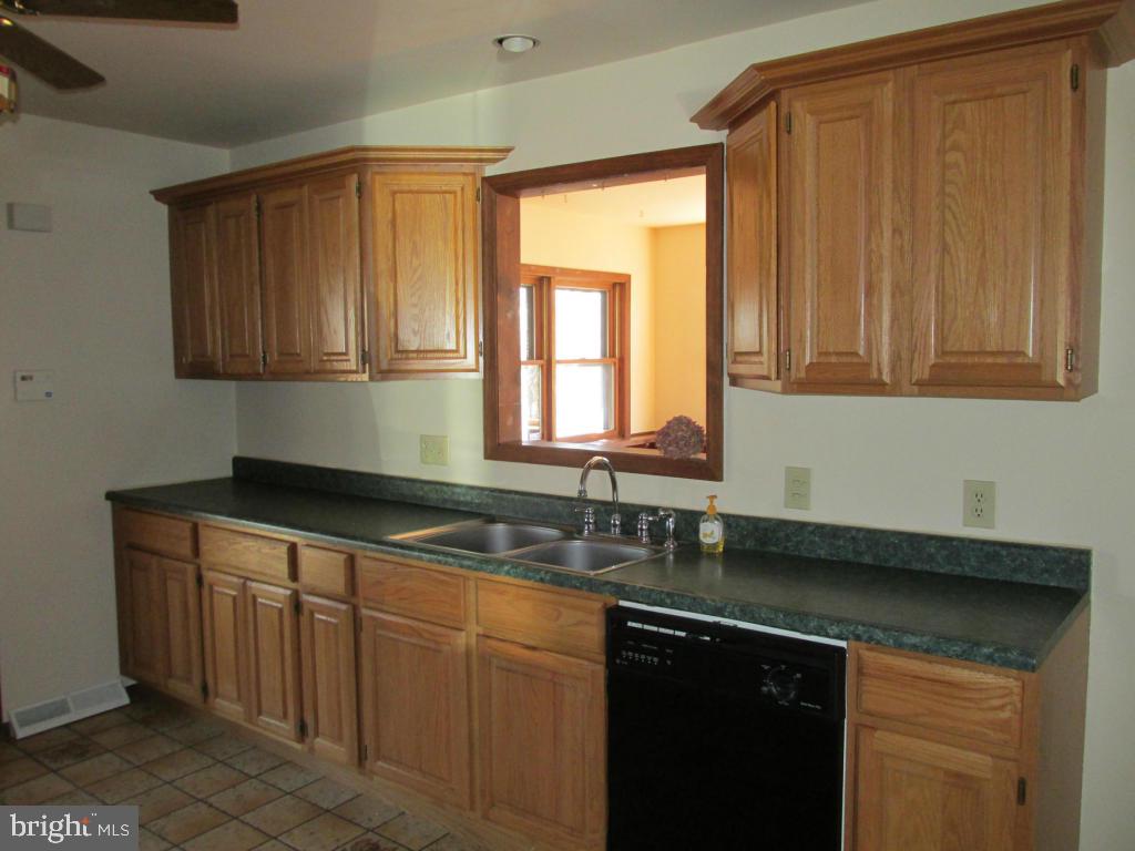 1161 Cider Press Road Manheim, PA 17545 - Photo 10 of 56 a kitchen with granite countertop cabinets sink and window