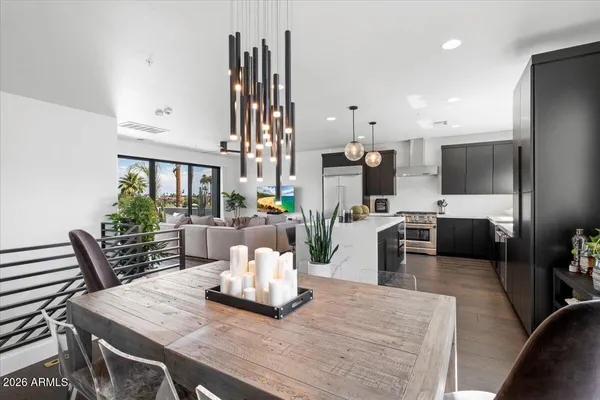 a kitchen with stainless steel appliances a sink stove and refrigerator