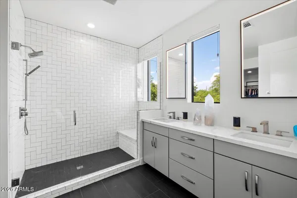 a bedroom with furniture and a potted plant
