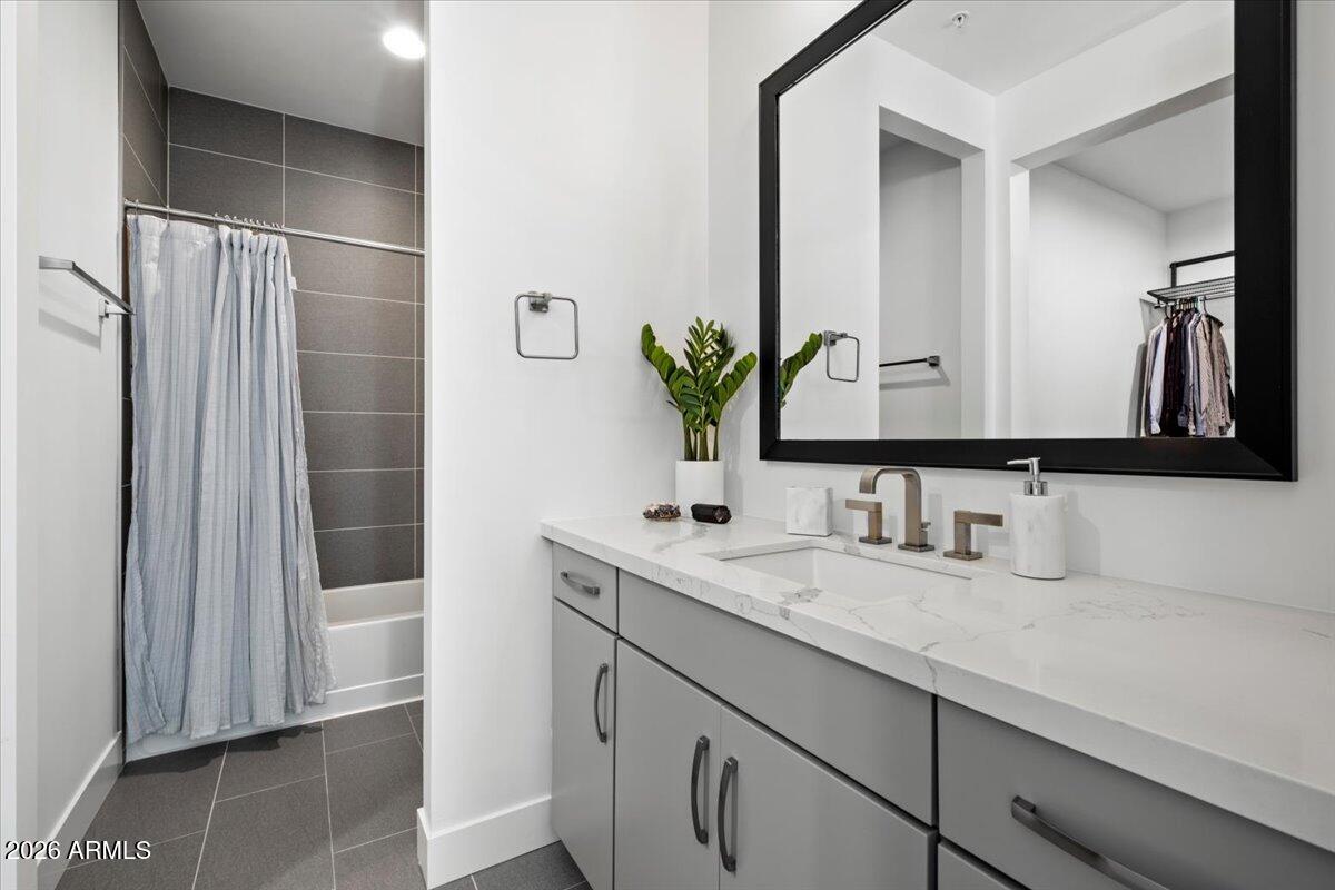 4331 North 27th Place Phoenix, AZ 85016 - Photo 18 of 33 a bathroom with a double vanity sink and a mirror
