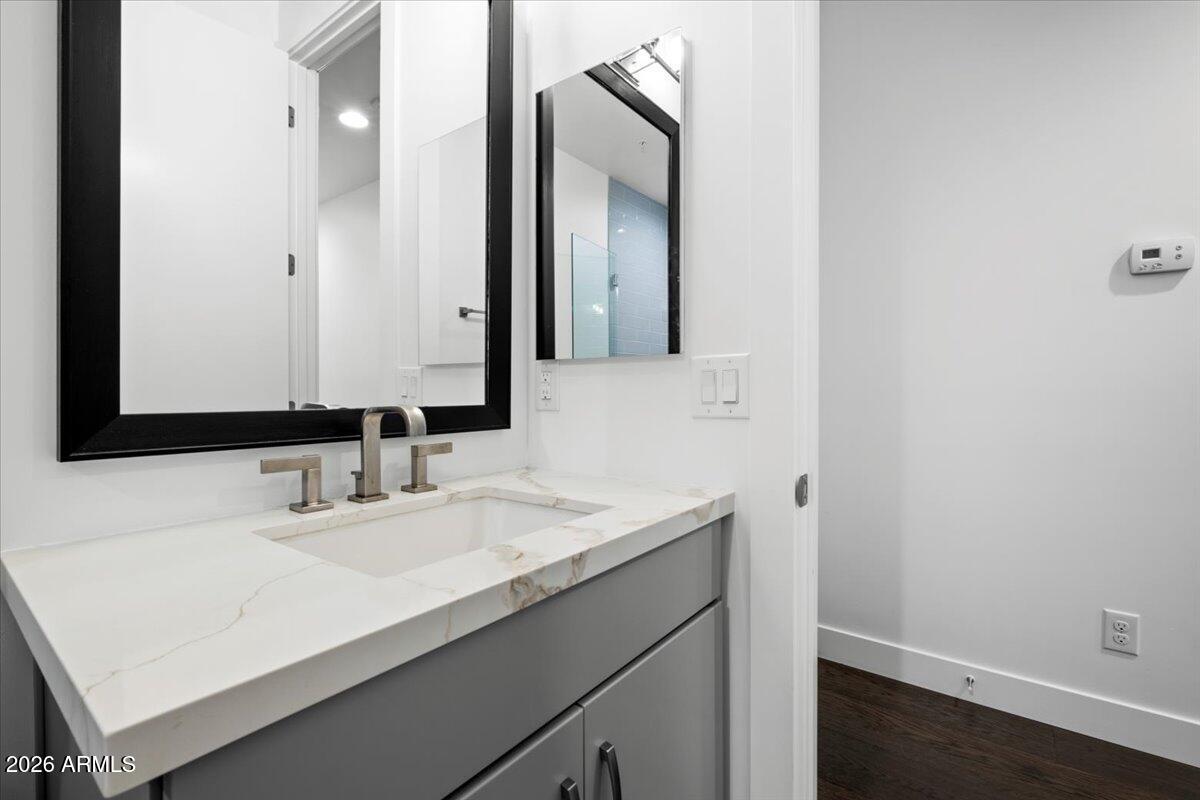 4331 North 27th Place Phoenix, AZ 85016 - Photo 20 of 33 a bathroom with a sink and a mirror