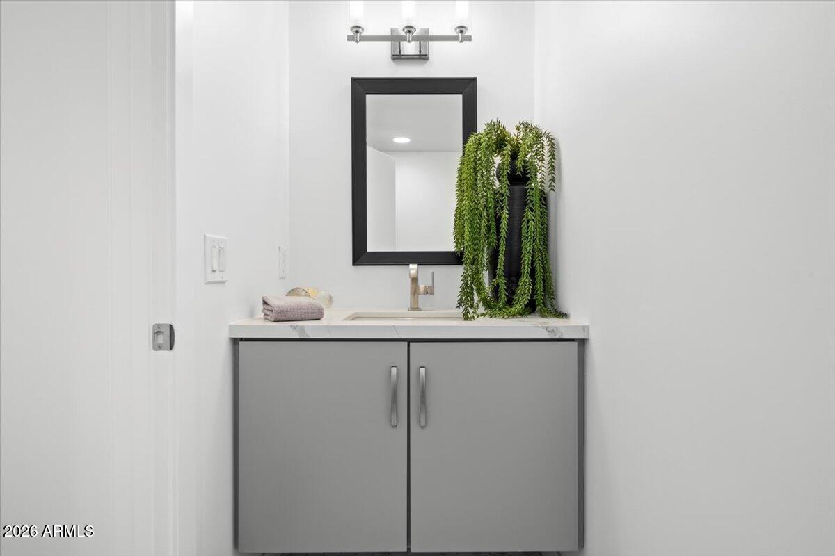 4331 North 27th Place Phoenix, AZ 85016 - Photo 22 of 33 a bathroom with a sink vanity and mirror