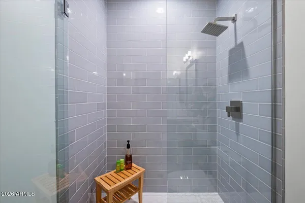 a bathroom with a sink vanity and mirror