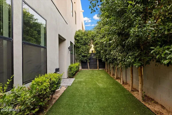 a outdoor dining space with furniture and garden view
