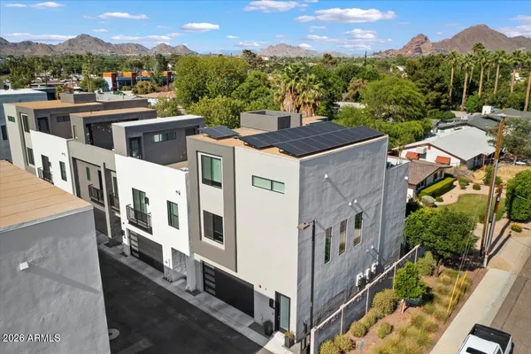 an aerial view of a house with a garden
