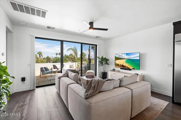 a living room with furniture and a large window