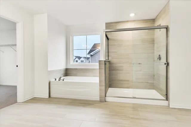 a bathroom with a bathtub and a shower