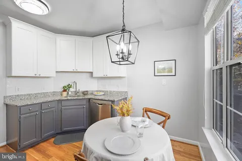 a kitchen with stainless steel appliances a sink and cabinets