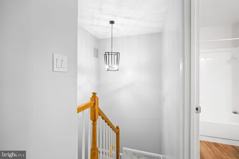 a view of a hallway with a white walls