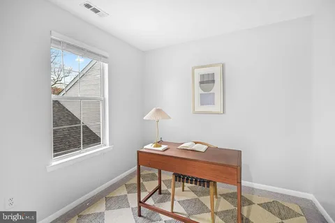 a room with a bed and a window