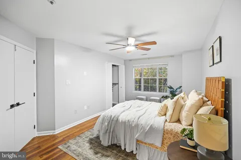 a bedroom with a bed and cabinets