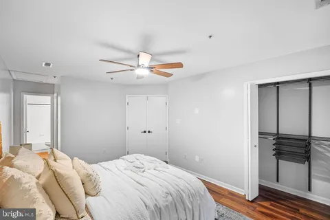 a living room with furniture and a white wall
