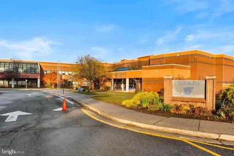 a view of a building with a street
