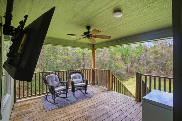 a view of a two chairs and table in the balcony