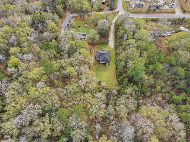 a backyard of a house with a yard and fountain