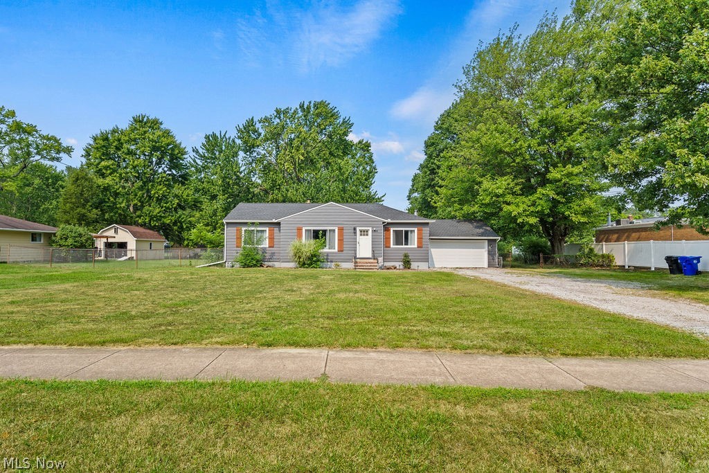 Ranch-style home with a front yard