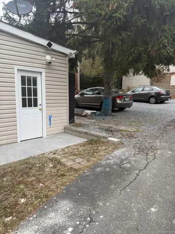 a view of a car parked in front of a house
