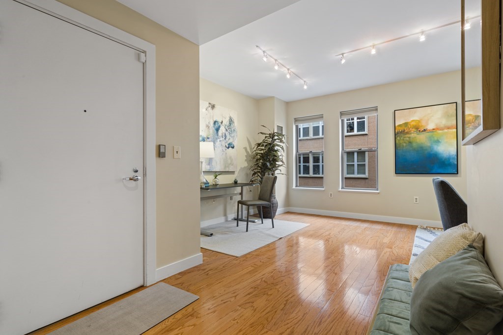 15 Savoy Street, Unit D309 Boston, MA 02118 - Photo 11 of 31 a living room with furniture and a wooden floor