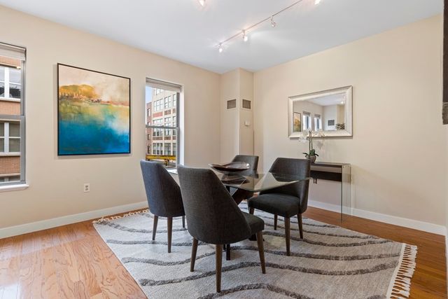 a view of a livingroom with furniture and wooden floor