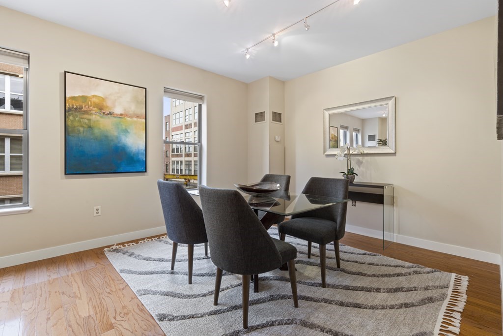 15 Savoy Street, Unit D309 Boston, MA 02118 - Photo 13 of 31 a view of a livingroom with furniture and wooden floor