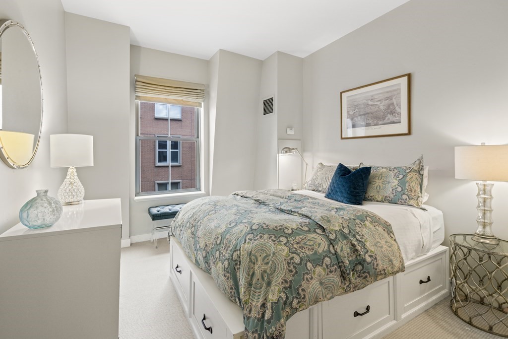 15 Savoy Street, Unit D309 Boston, MA 02118 - Photo 15 of 31 a bedroom with a bed and wooden floor