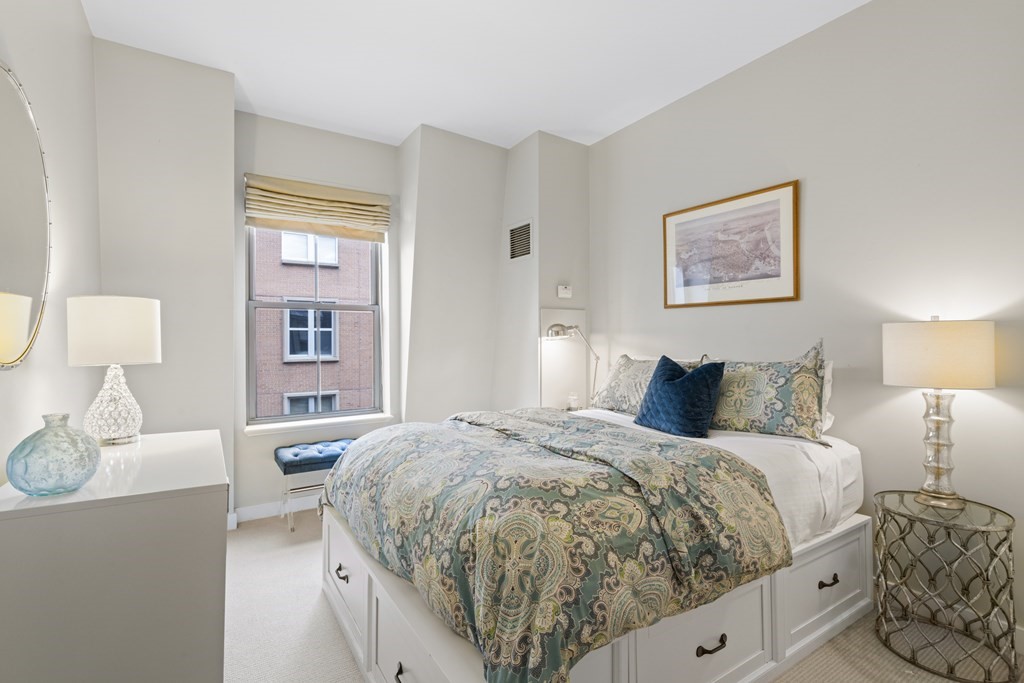 15 Savoy Street, Unit D309 Boston, MA 02118 - Photo 16 of 31 a bedroom with a bed and a couch