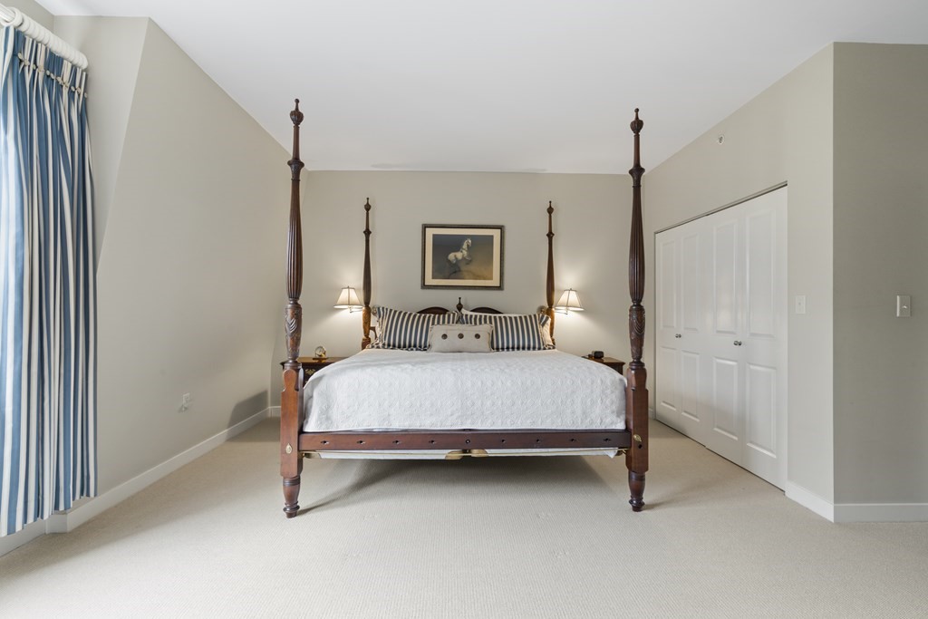 15 Savoy Street, Unit D309 Boston, MA 02118 - Photo 20 of 31 a bed room with a bed and a night stand