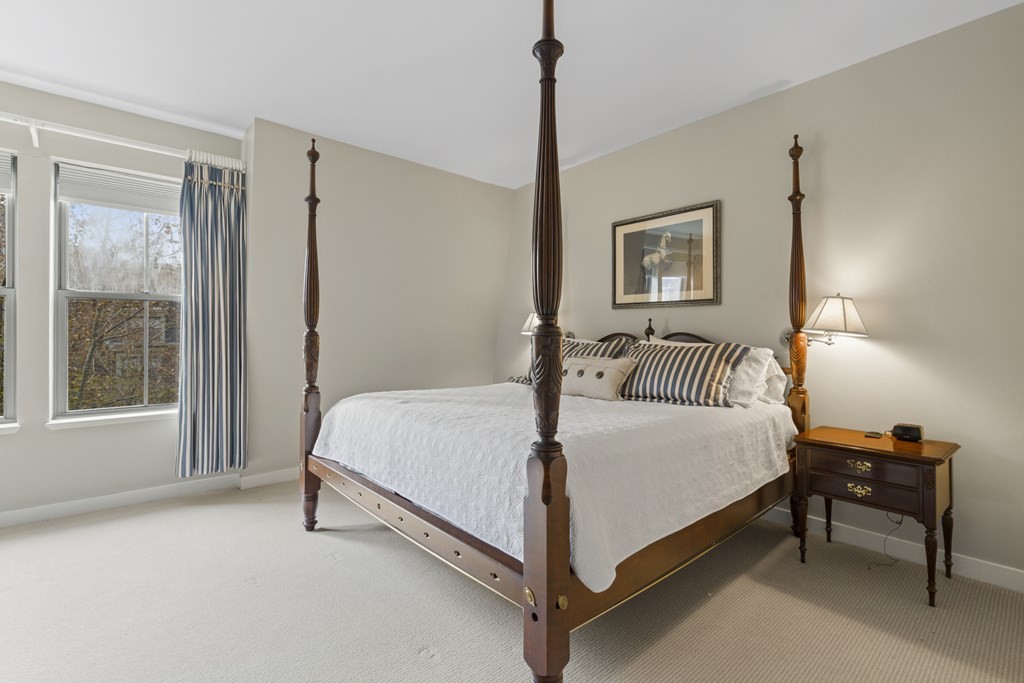15 Savoy Street, Unit D309 Boston, MA 02118 - Photo 21 of 31 a bedroom with a bed and a window