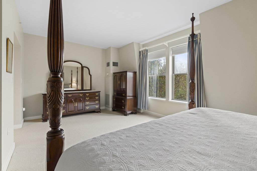 15 Savoy Street, Unit D309 Boston, MA 02118 - Photo 22 of 31 a view of a bedroom with cabinet mirror and windows