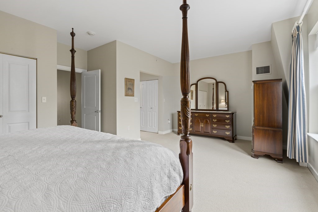 15 Savoy Street, Unit D309 Boston, MA 02118 - Photo 23 of 31 a bed room with a bed window and a television