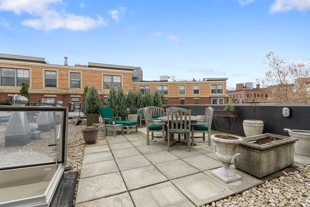 a view of a terrace with sitting area