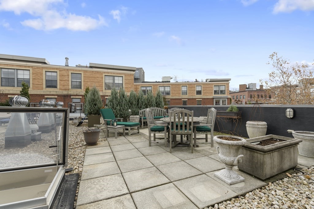 15 Savoy Street, Unit D309 Boston, MA 02118 - Photo 28 of 31 a view of a terrace with sitting area