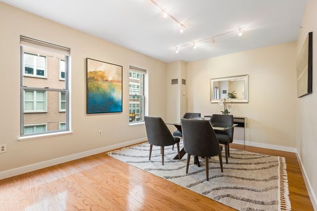 a view of a livingroom with furniture and wooden floor