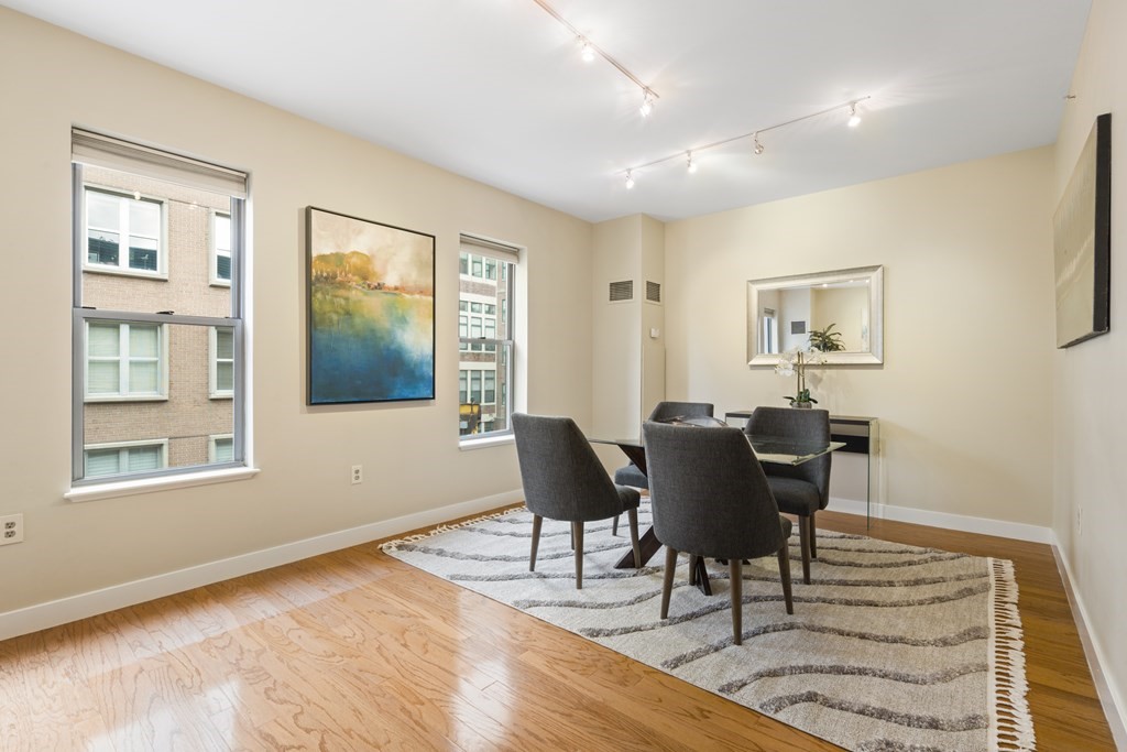 15 Savoy Street, Unit D309 Boston, MA 02118 - Photo 8 of 31 a view of a livingroom with furniture and wooden floor