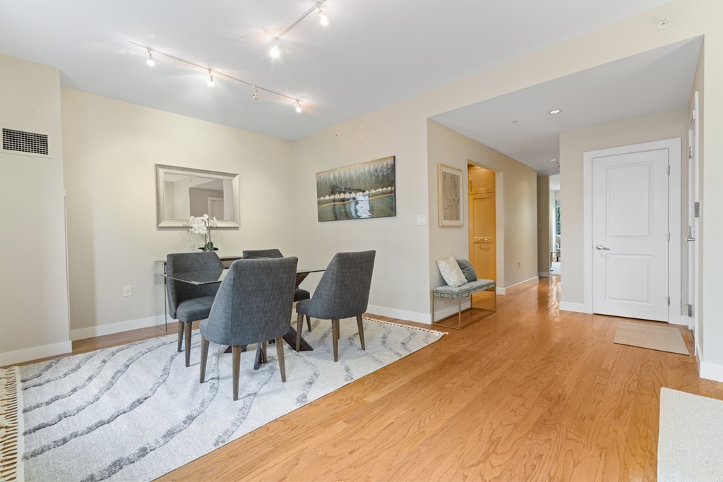15 Savoy Street, Unit D309 Boston, MA 02118 - Photo 9 of 31 a view of a dining room with furniture and wooden floor