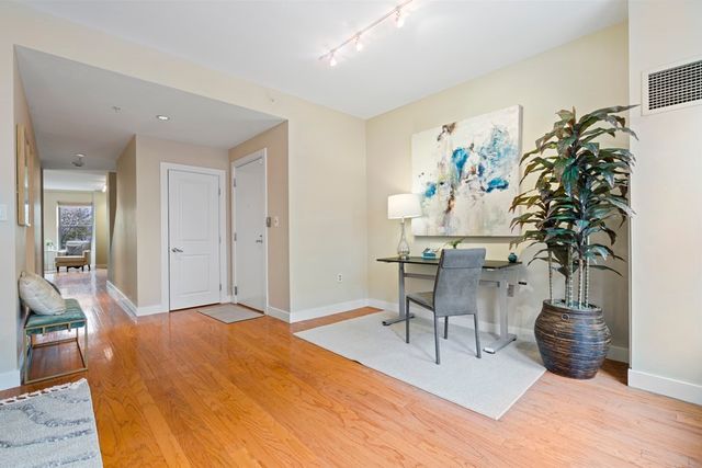 a workspace with furniture and a potted plant