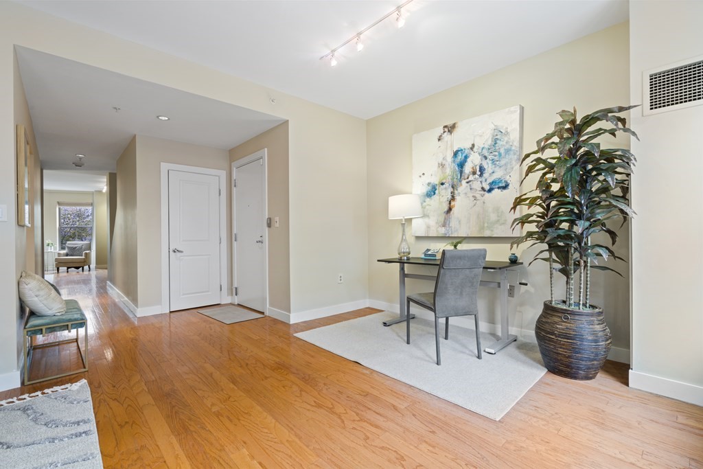 15 Savoy Street, Unit D309 Boston, MA 02118 - Photo 10 of 31 a workspace with furniture and a potted plant