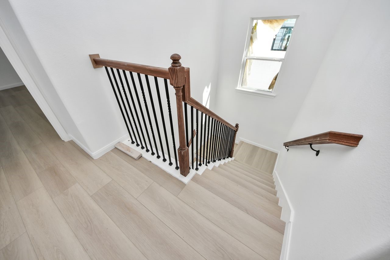 8653 Sunderland Road Houston, TX 77028 - Photo 6 of 14 a view of a hallway with stairs
