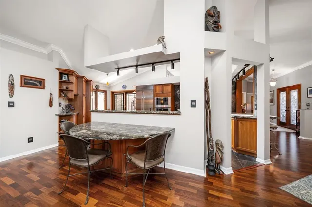 a view of a table and chairs in a room