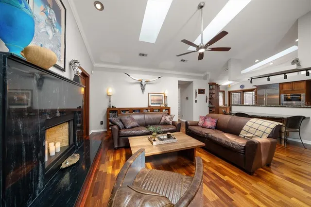 a view of a workspace with furniture window and wooden floor